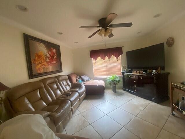 tiled living room with ceiling fan