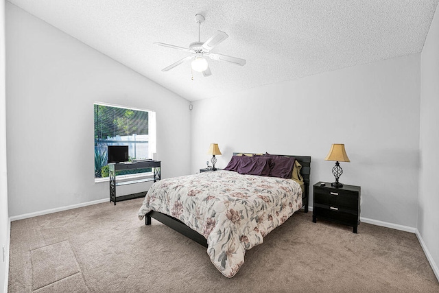 bedroom with ceiling fan, light colored carpet, a textured ceiling, and vaulted ceiling