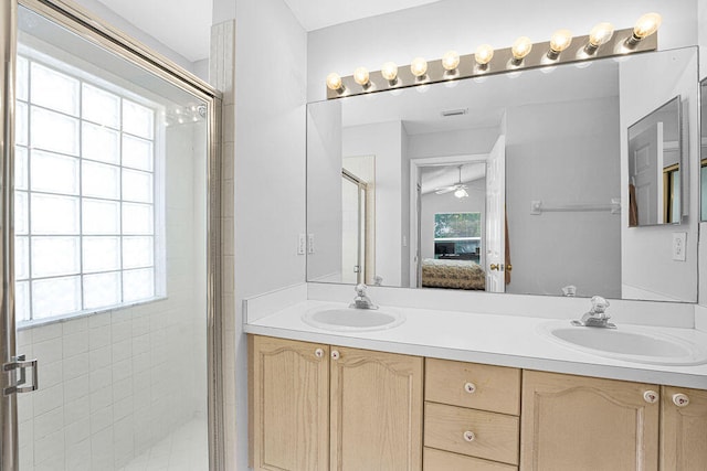 bathroom with plenty of natural light and a shower with shower door