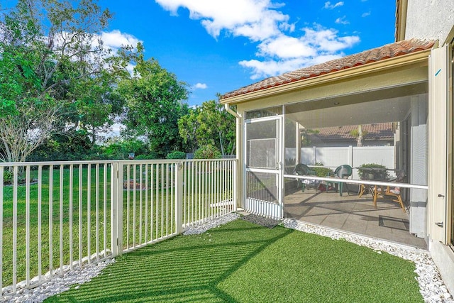 view of yard featuring a sunroom