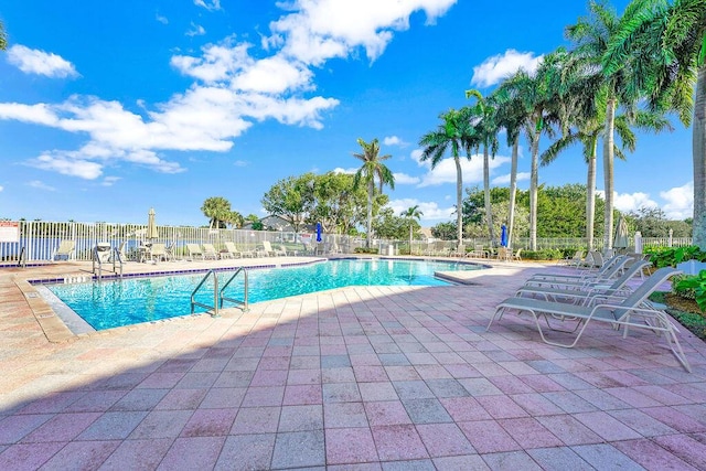 view of swimming pool featuring a patio