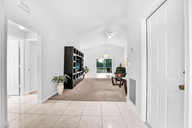 living room with ceiling fan, light colored carpet, and lofted ceiling