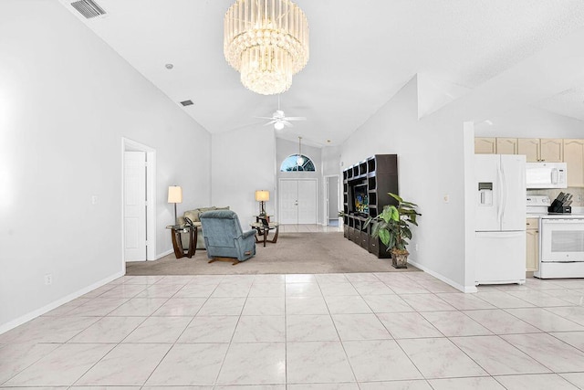 foyer with ceiling fan with notable chandelier and high vaulted ceiling