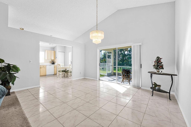 spare room featuring light tile patterned floors, high vaulted ceiling, and an inviting chandelier