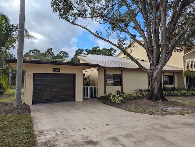 ranch-style house featuring a garage