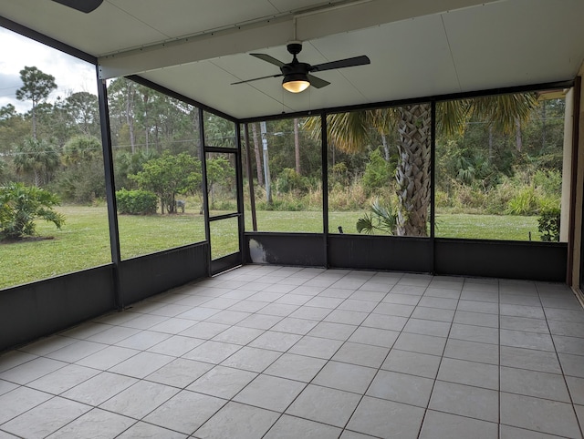 unfurnished sunroom featuring plenty of natural light and ceiling fan