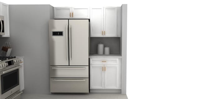 kitchen featuring white cabinets and appliances with stainless steel finishes