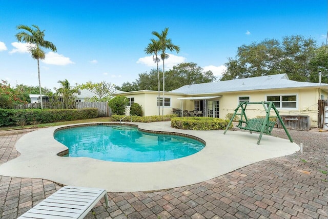 view of pool featuring a patio