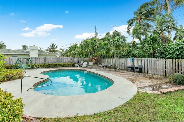 view of swimming pool featuring a patio