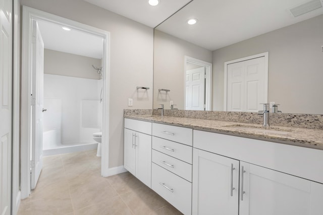 full bathroom with toilet, a sink, visible vents, double vanity, and walk in shower