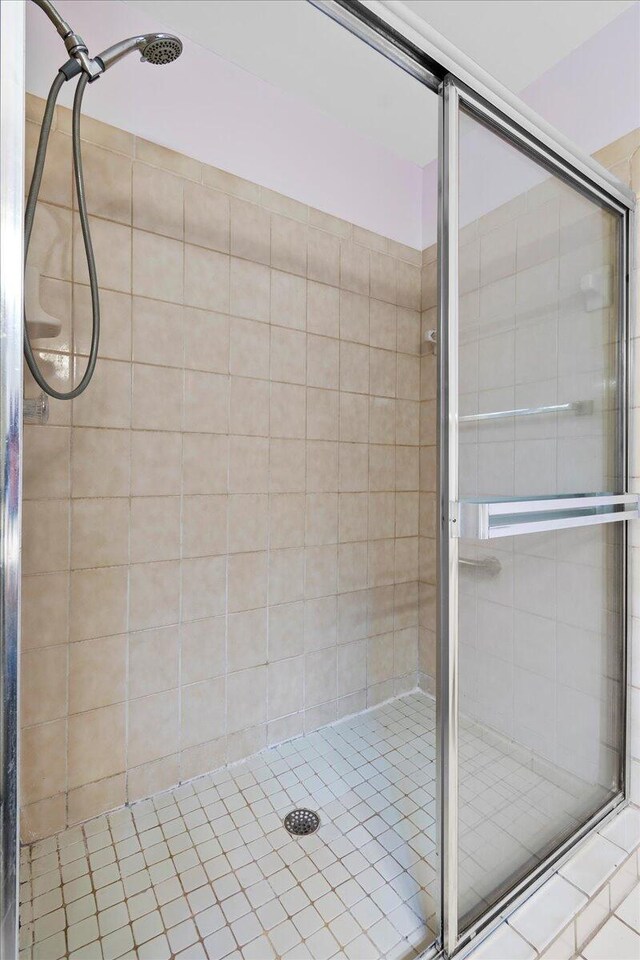 bathroom featuring an enclosed shower