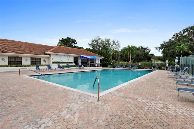 view of swimming pool with a patio