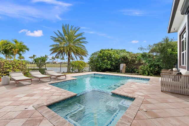 exterior space with ceiling fan, a patio, and an outdoor living space with a fire pit