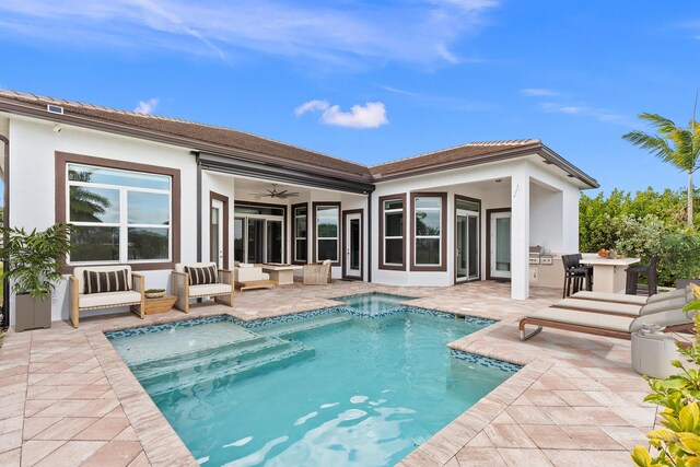 view of swimming pool with a patio area and an in ground hot tub