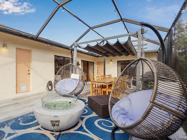 view of patio / terrace featuring a lanai