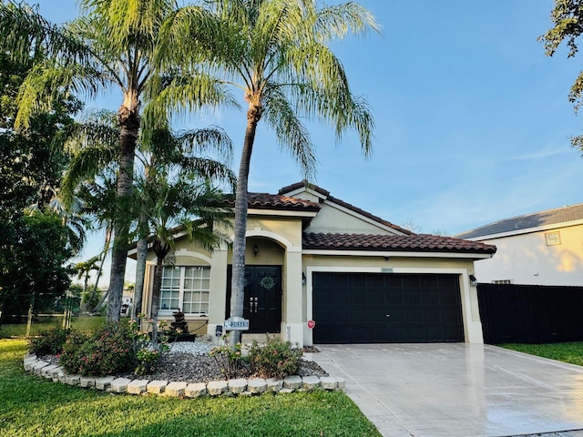 mediterranean / spanish house featuring a garage