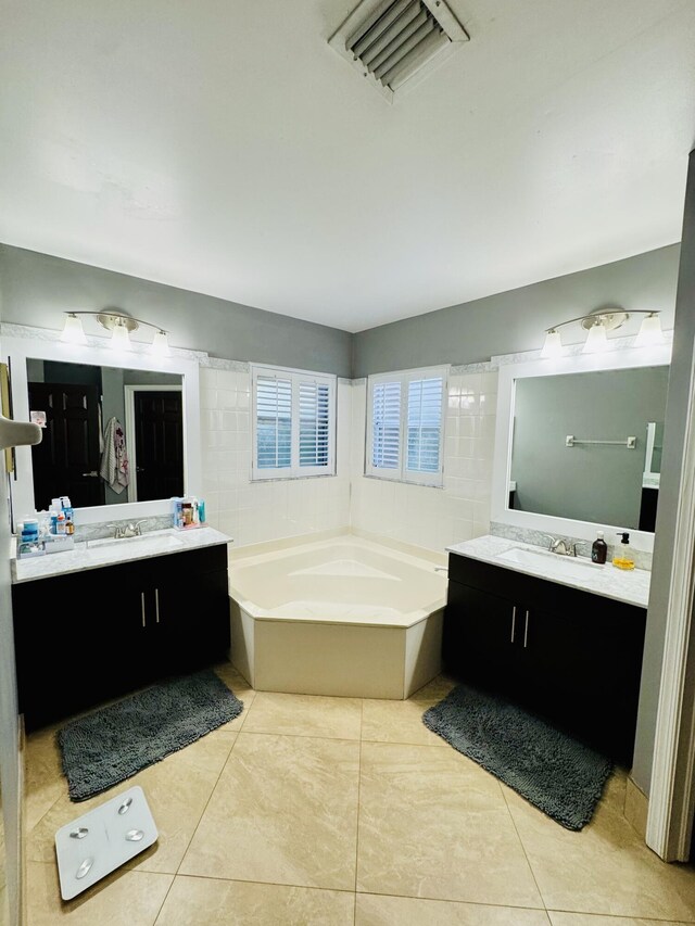 tiled dining area with a textured ceiling and ceiling fan