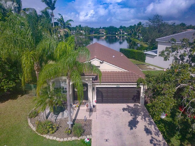 mediterranean / spanish-style home with a garage