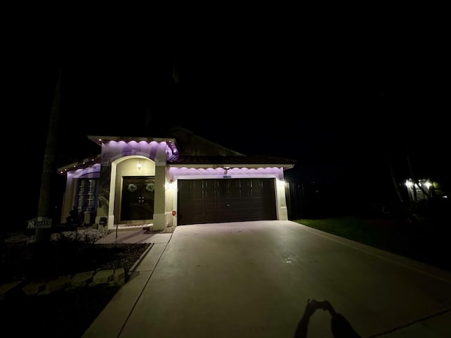 mediterranean / spanish home featuring a garage