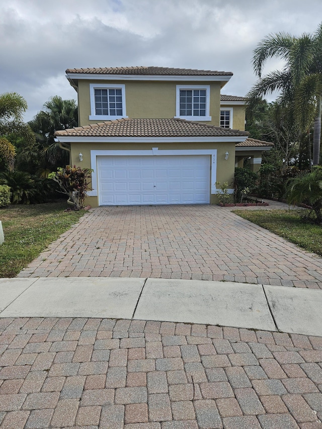 view of front of property with a garage