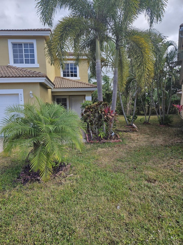 view of yard featuring a garage