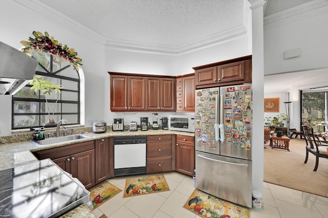 kitchen with sink, light colored carpet, a textured ceiling, white appliances, and ornamental molding