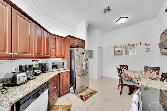 kitchen featuring dishwashing machine, stainless steel fridge, light stone countertops, and a textured ceiling