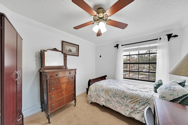 carpeted bedroom featuring ceiling fan, crown molding, and a textured ceiling