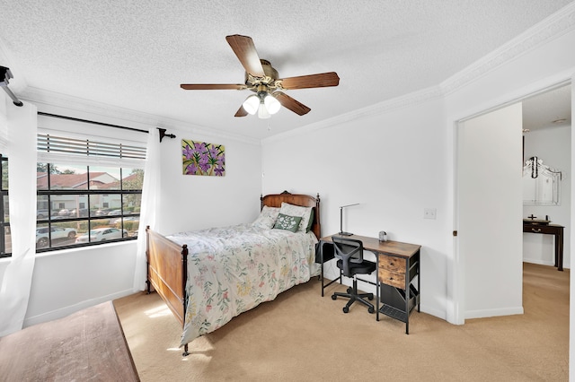 carpeted bedroom with ceiling fan, ornamental molding, and a textured ceiling