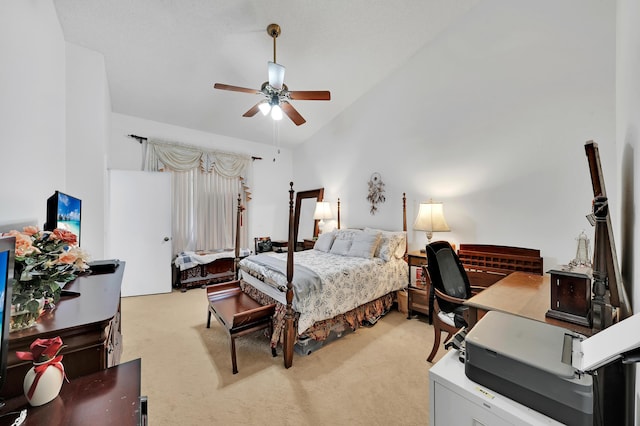 carpeted bedroom with ceiling fan and lofted ceiling