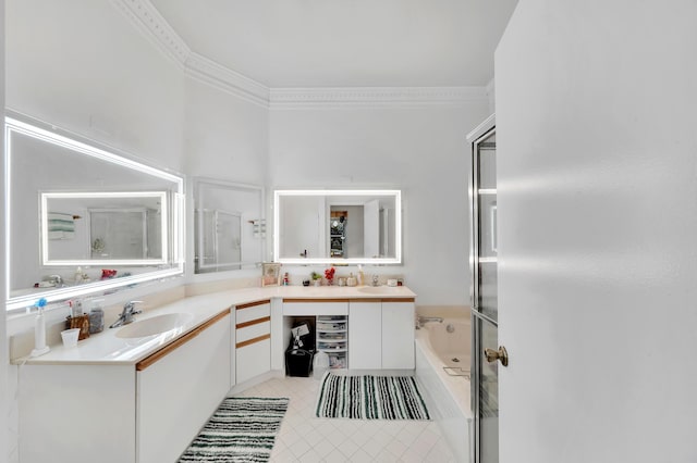 bathroom with vanity, ornamental molding, and a tub to relax in