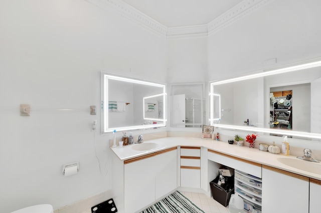 bathroom featuring vanity and ornamental molding