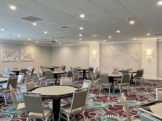 dining space featuring carpet flooring and ornamental molding