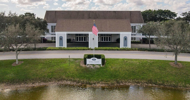 view of building exterior with a water view