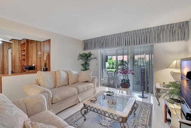 tiled living room featuring wood walls