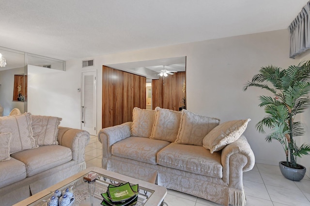 living room with ceiling fan and light tile patterned floors