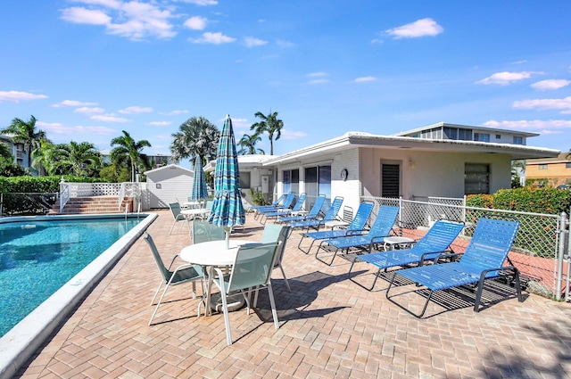 view of swimming pool with a patio