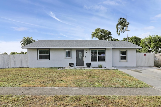 single story home featuring a front yard