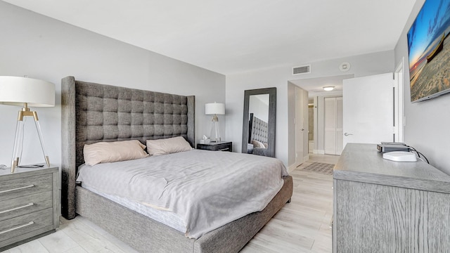 bedroom with light wood-type flooring