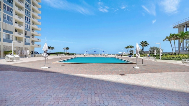 view of swimming pool featuring a patio area