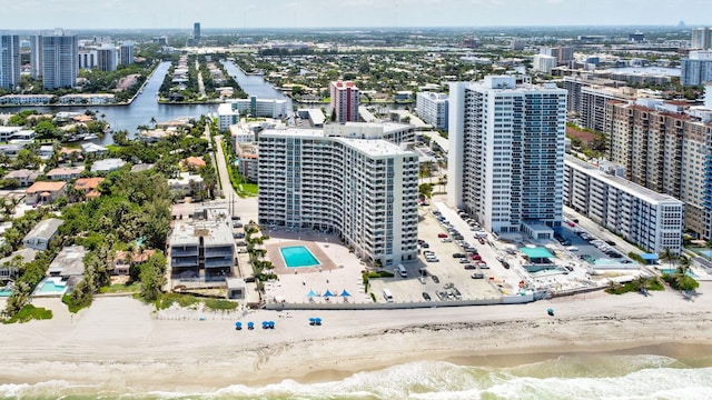 bird's eye view with a water view and a view of the beach