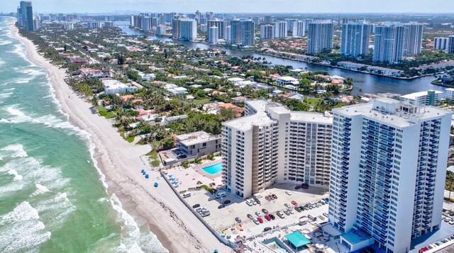 aerial view featuring a water view and a beach view