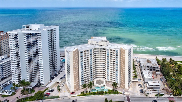 aerial view with a water view and a view of the beach