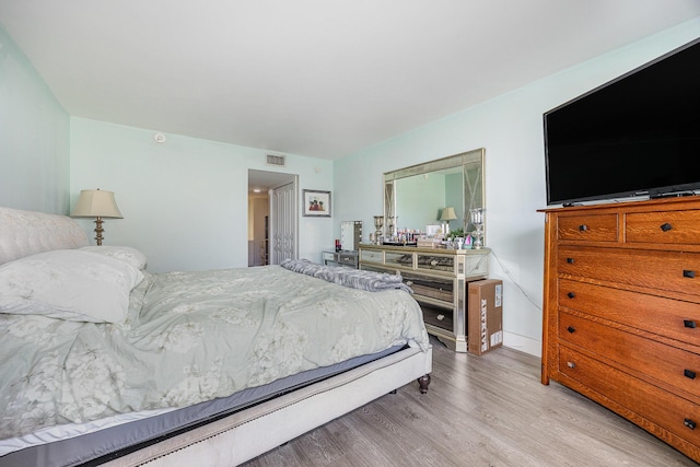 bedroom featuring light hardwood / wood-style floors