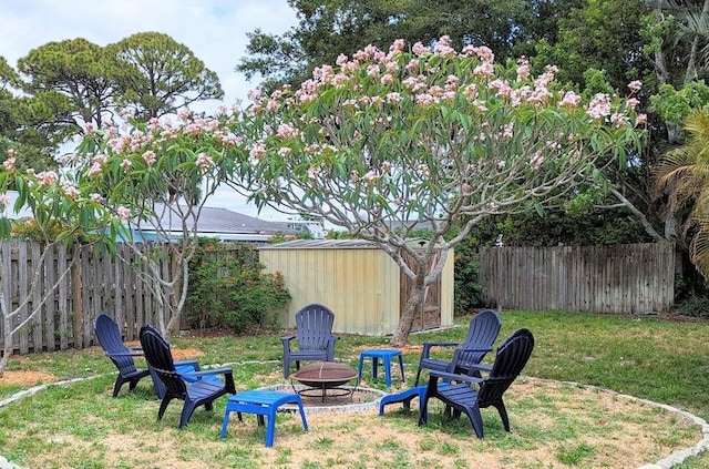 view of yard with a fire pit