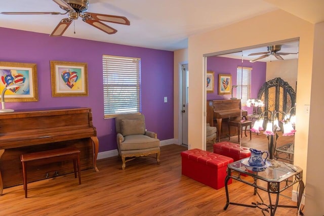 sitting room featuring hardwood / wood-style floors, a wealth of natural light, and ceiling fan