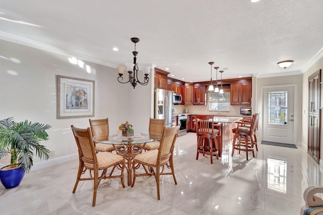 tiled dining area with a textured ceiling, an inviting chandelier, ornamental molding, and sink