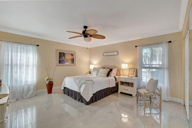 bedroom with ceiling fan and ornamental molding