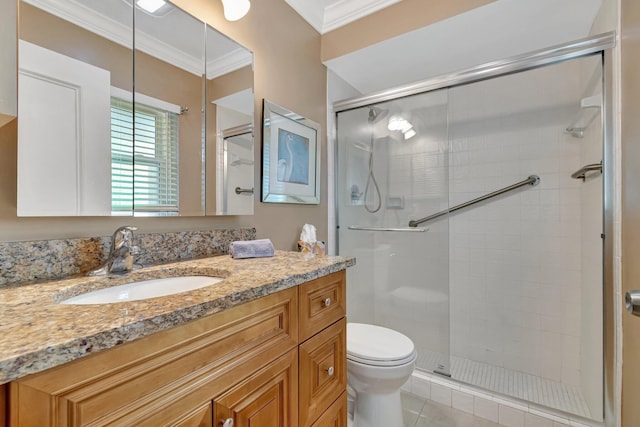 bathroom featuring walk in shower, ornamental molding, vanity, tile patterned flooring, and toilet