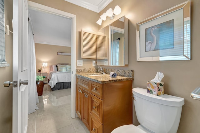 bathroom with vanity, toilet, and crown molding